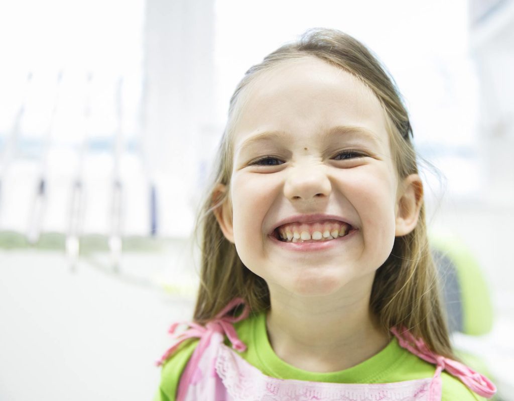 Young girl smiling at the dentist's office